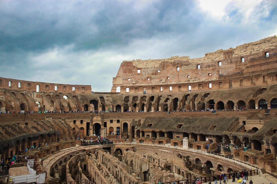 Colosseum Entry with digital audioguide and arena option - Meeting at the Arch of Constantine and getting inside without a hassle