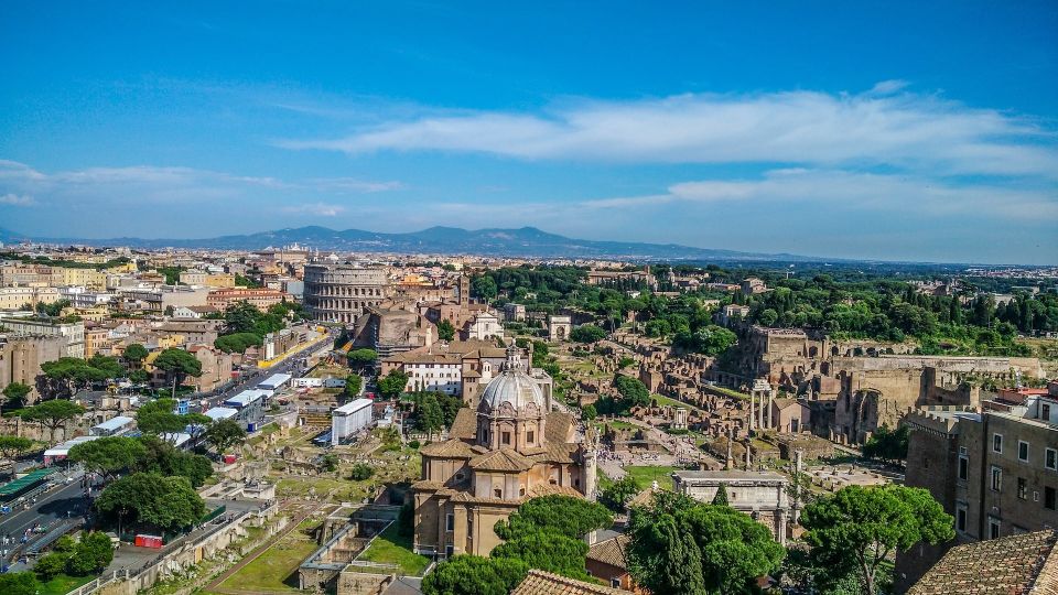 Rome: Best of Colosseum and Roman Forum Guided Tour - Walking past the Arch of Constantine and seeing why it matters