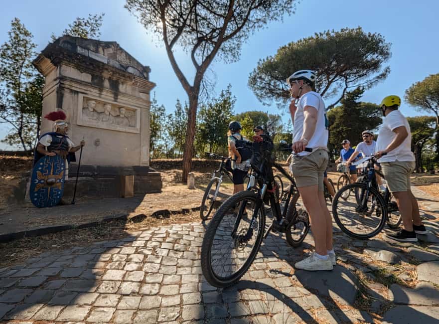 Rome:Appian Way E-bike Tour, Catacombs, Aqueducts & Transfer - Entering the Appian Way on an e-bike